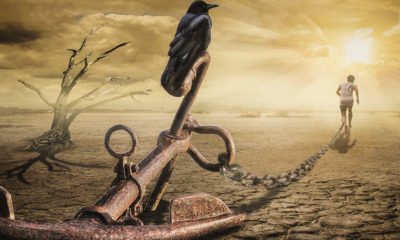 Man dragging anchor from the past