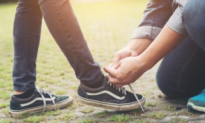 Fixer ties girlfriend's shoe