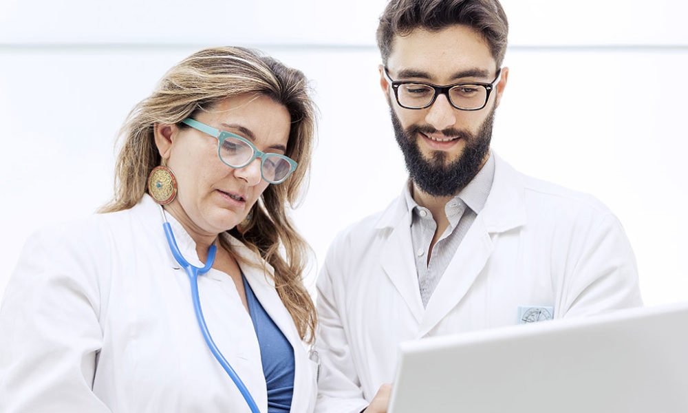 Doctors reviewing patient chart