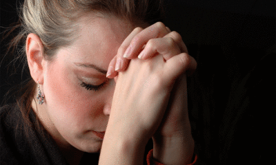 woman praying about addict son
