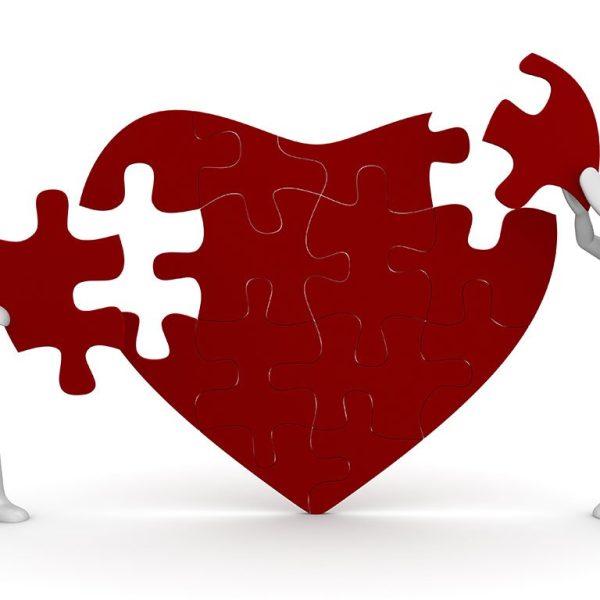 Cartoon couple mending heart